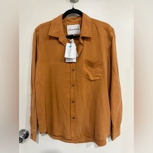 Lola River Women's Dyed Tencel Bottom down Shirt in a brown or saddle color.